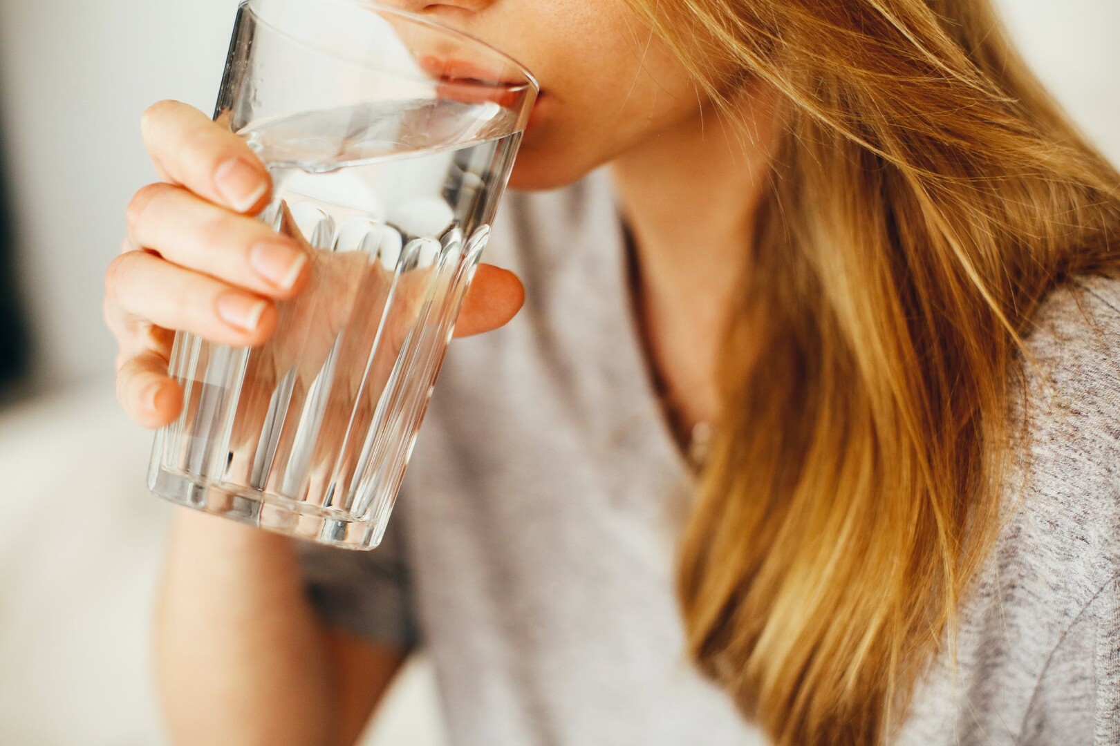 Woman drinking water.