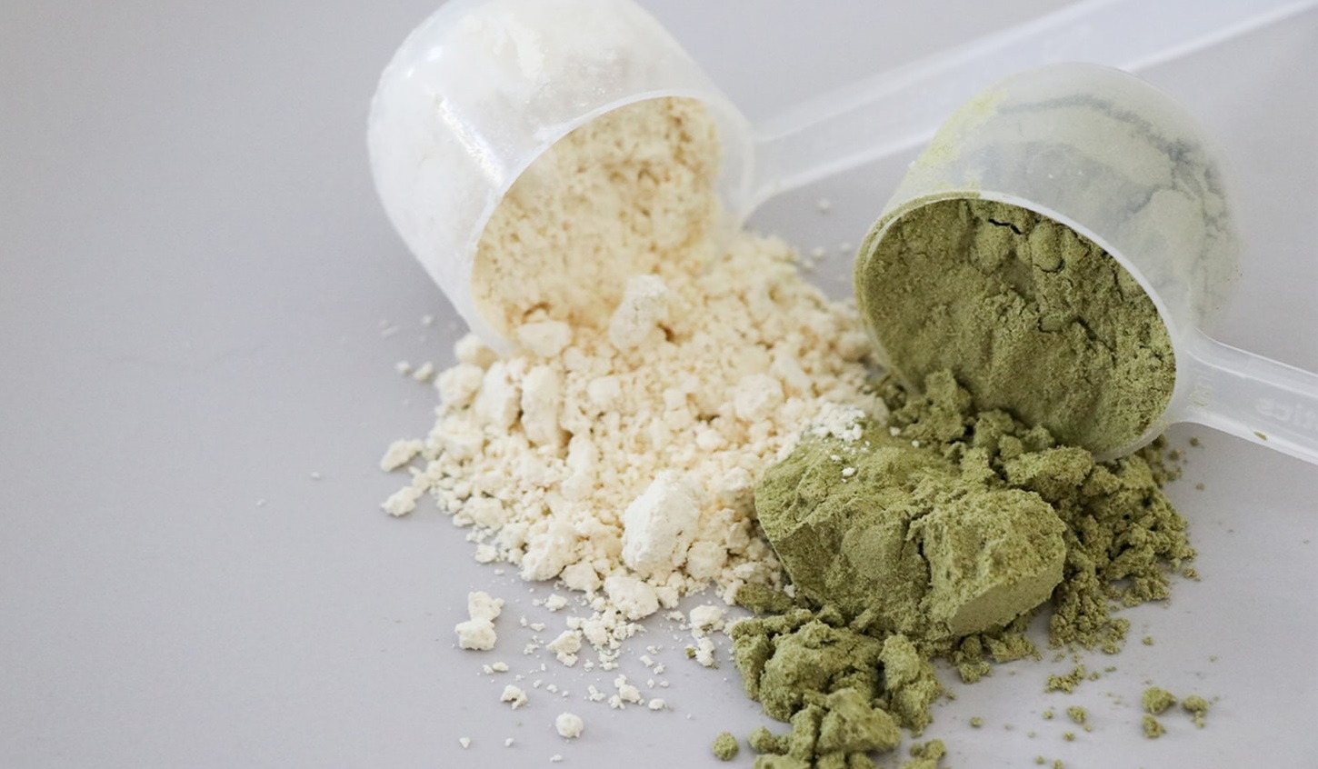 Green and white protein powders.