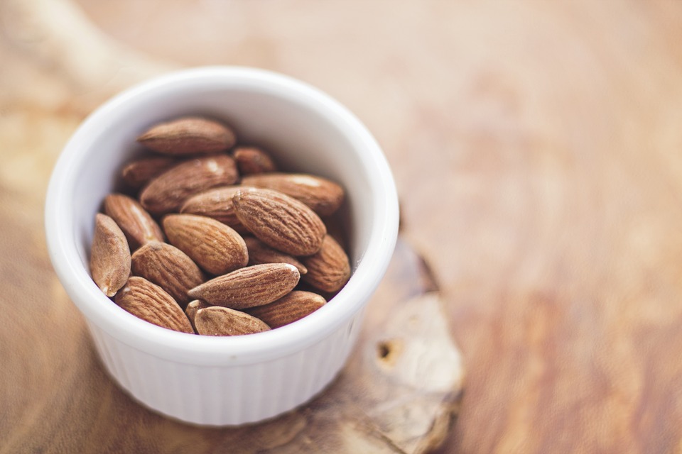 Ramekin with almonds in it.