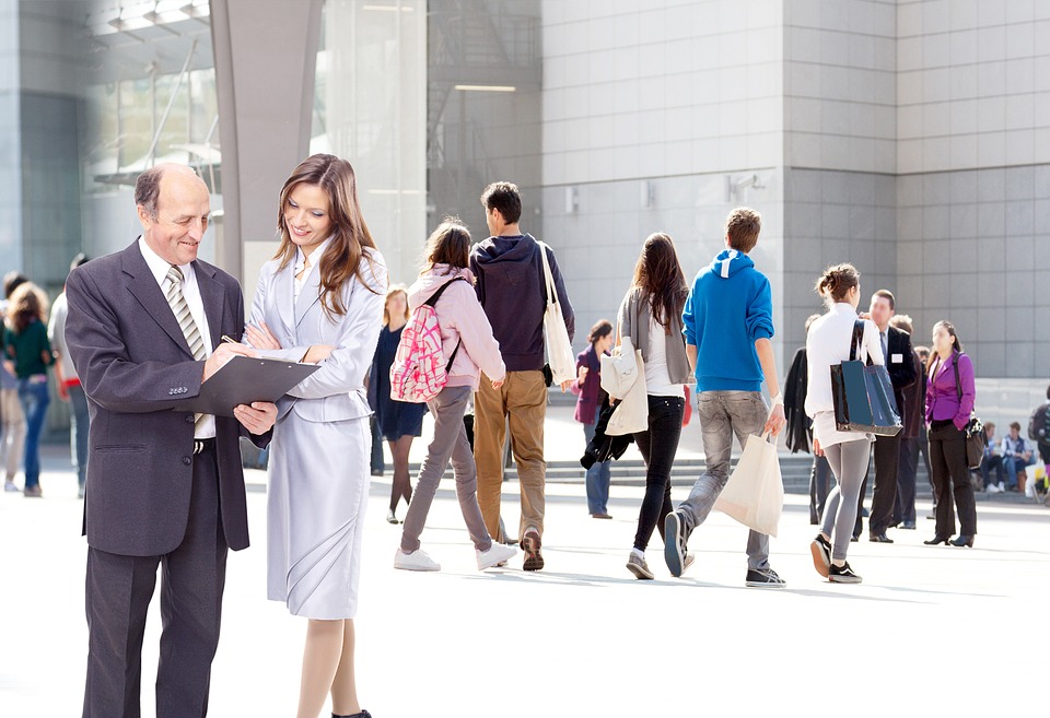 Employees gathering outside of high-rise.