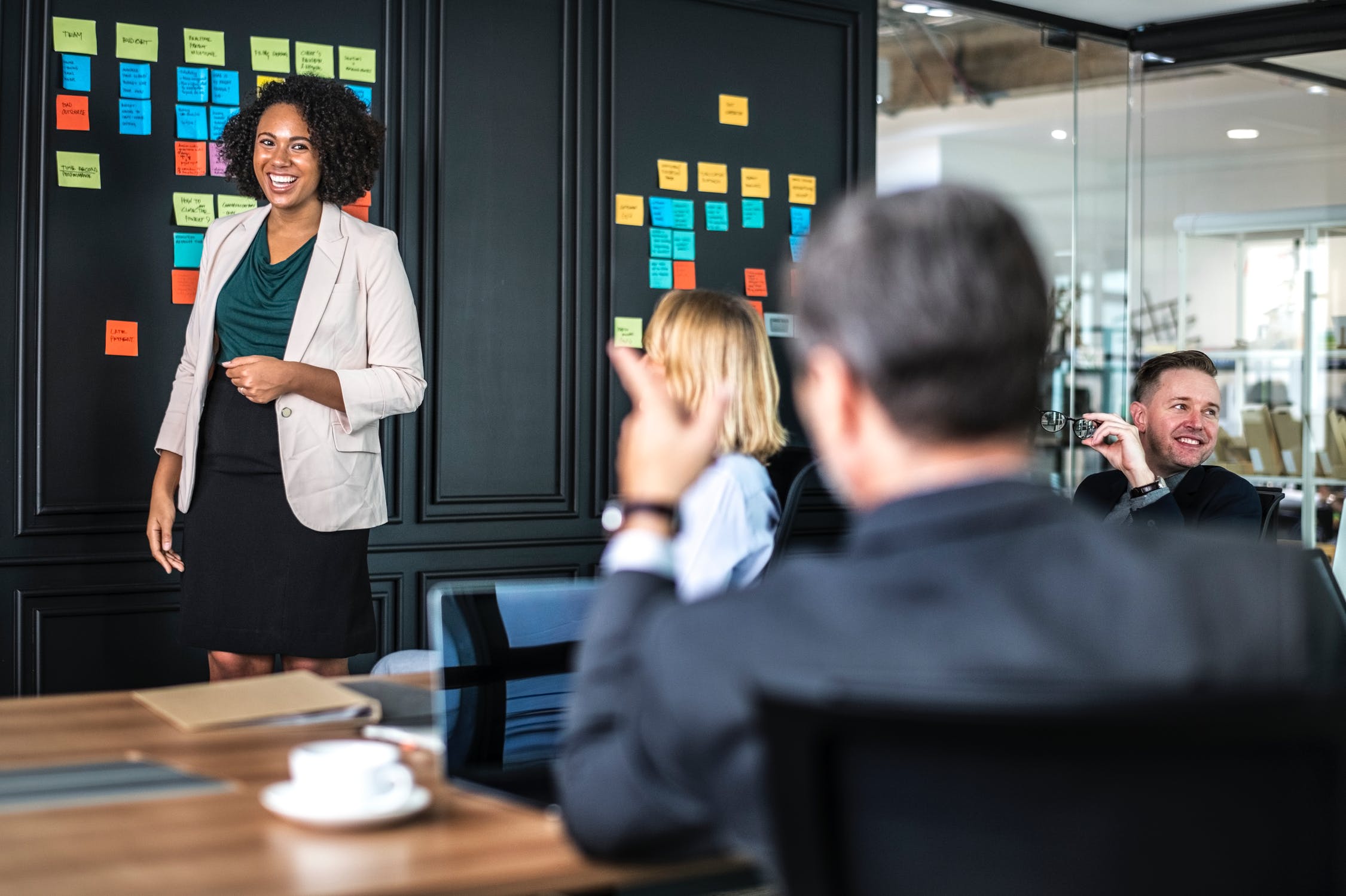 Woman giving presentation in conference room.