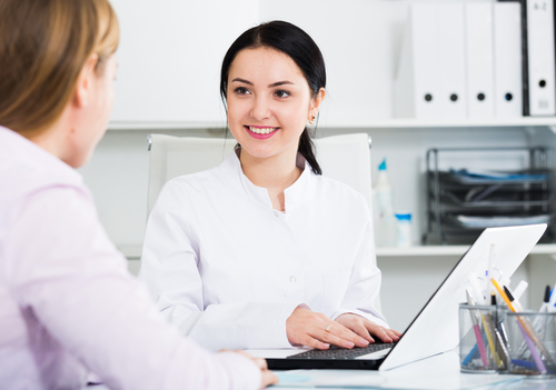 Woman sitting in a metabolic consultation.