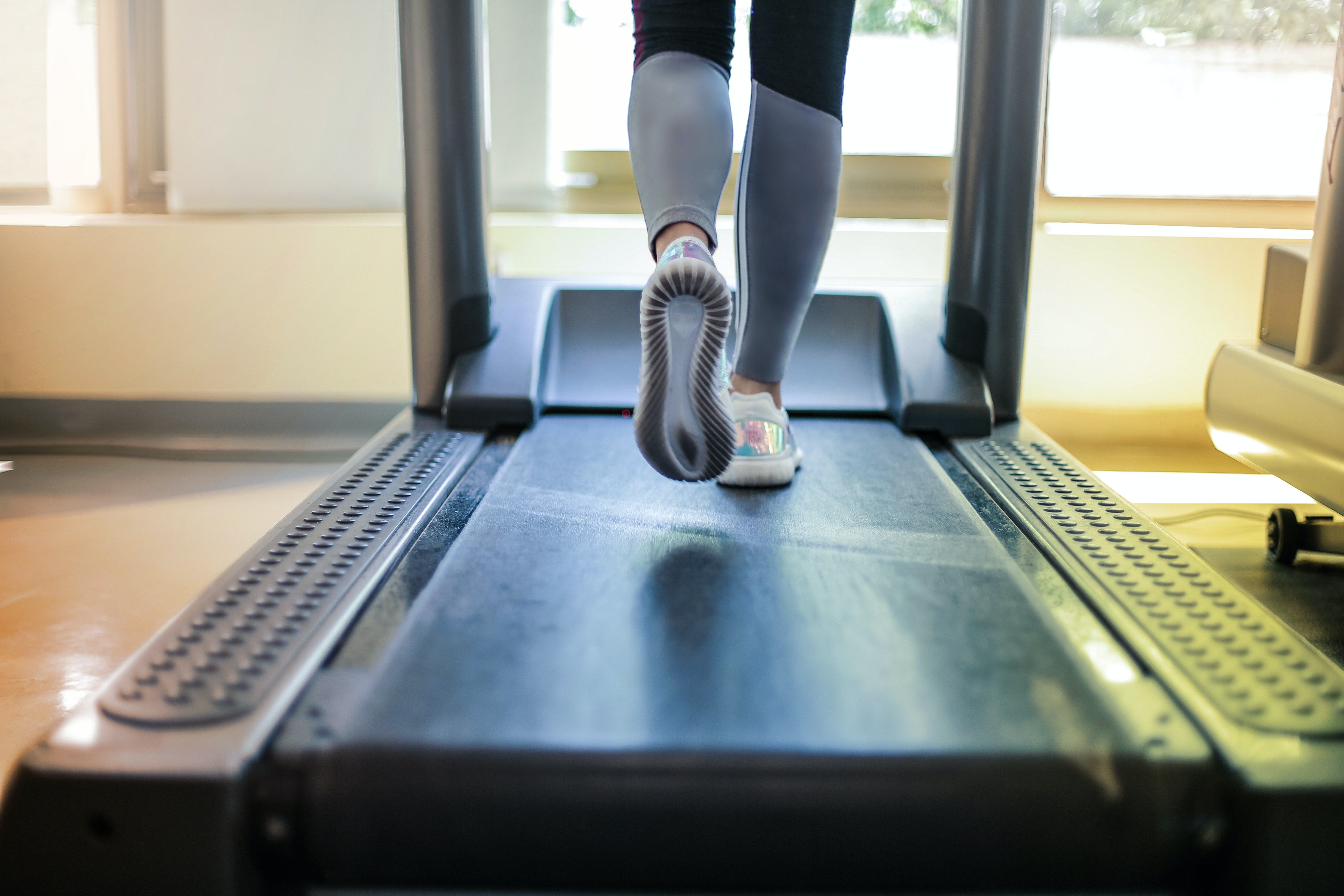 Woman running on treadmill.
