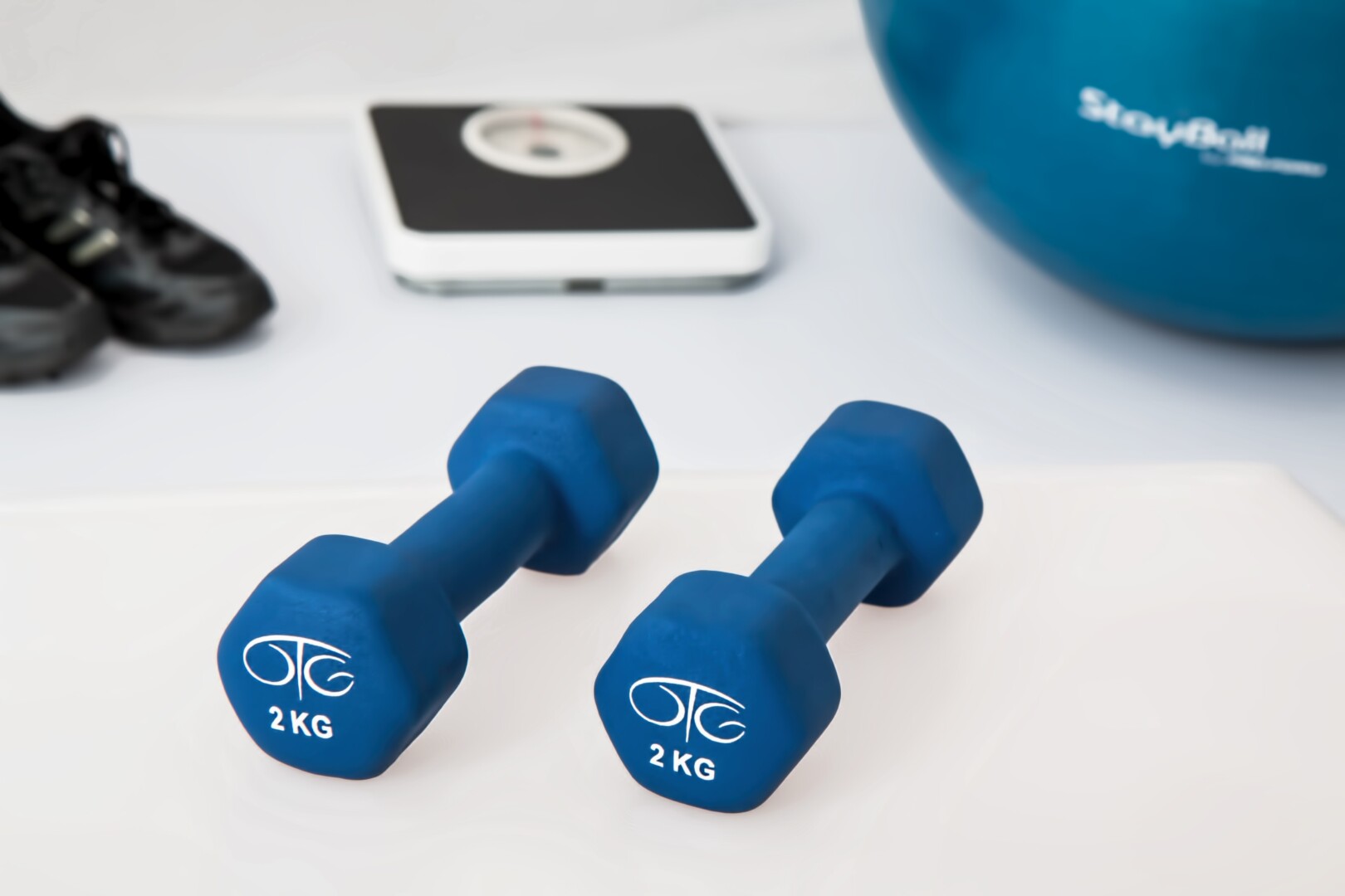 Pair of dumbbells on floor.