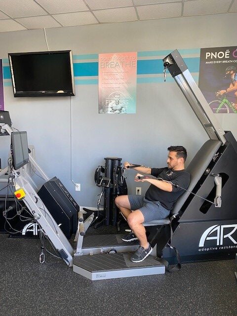 Man working out on ARX machine at Leo's Fitness Lab.