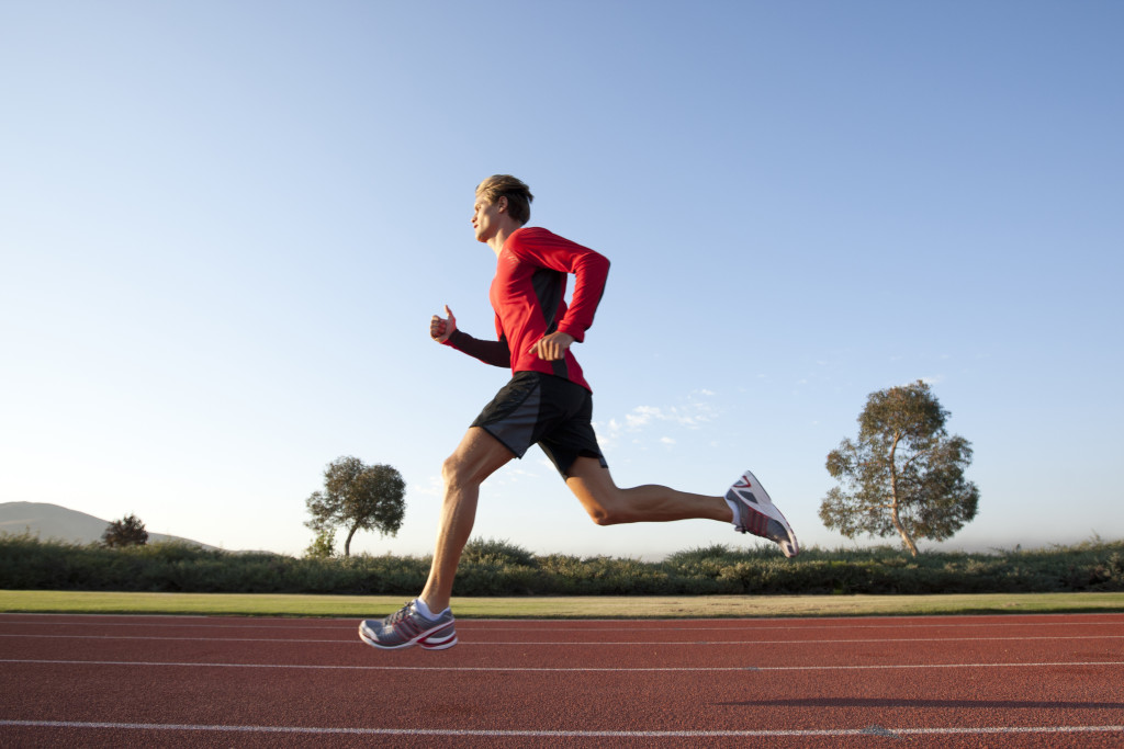 Man running on track.