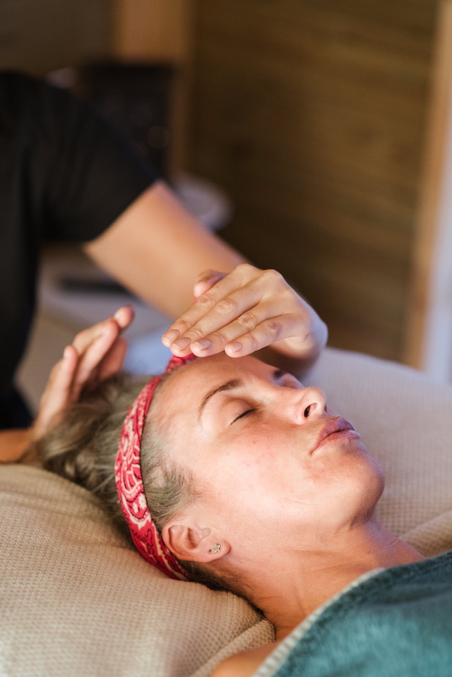 Woman in a reiki session.