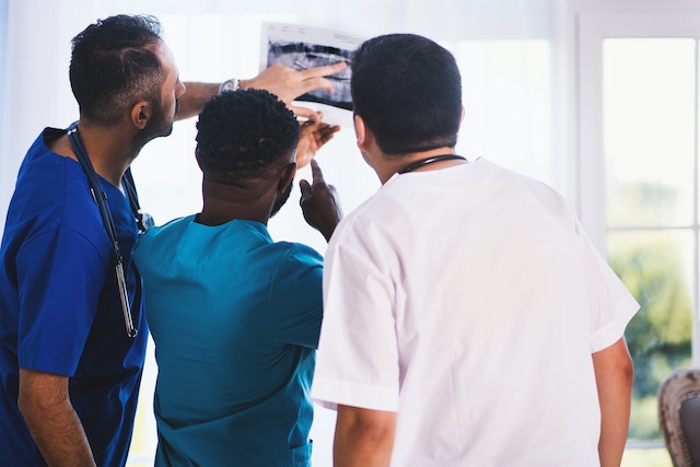 Doctors examining x-ray.