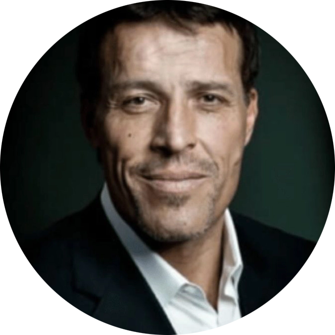 Professional headshot of a smiling man in dark blazer and white collared shirt against dark teal background